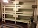 Triple bunk beds and large air filter in basement at 1041 E 9Th Dr, Mesa, AZ 85204