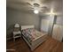 Bedroom with a queen bed and ceiling fan at 1041 E 9Th Dr, Mesa, AZ 85204