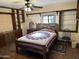 Charming bedroom featuring wooden floors and built-in shelves at 1041 E 9Th Dr, Mesa, AZ 85204