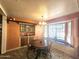 Cozy dining room featuring a bay window and built-in cabinets at 1041 E 9Th Dr, Mesa, AZ 85204