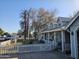 Gray house exterior with a white picket fence and American flag at 1041 E 9Th Dr, Mesa, AZ 85204