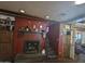 Rustic fireplace with built-in shelving and staircase at 1041 E 9Th Dr, Mesa, AZ 85204