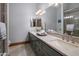 Elegant bathroom with dual sinks and a large mirror at 10452 E Quartz Rock Rd, Scottsdale, AZ 85255