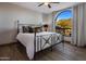 Bedroom with mountain view and arch window at 10452 E Quartz Rock Rd, Scottsdale, AZ 85255