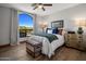 Bright bedroom with mountain views and wood floors at 10452 E Quartz Rock Rd, Scottsdale, AZ 85255