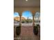 Front entry with mountain views and arched entryway at 10452 E Quartz Rock Rd, Scottsdale, AZ 85255