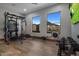 Home gym with state-of-the-art equipment and scenic views at 10452 E Quartz Rock Rd, Scottsdale, AZ 85255