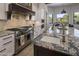 Modern kitchen with stainless steel appliances and granite countertops at 10452 E Quartz Rock Rd, Scottsdale, AZ 85255