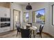 Kitchen nook with mountain views and glass table with four chairs at 10452 E Quartz Rock Rd, Scottsdale, AZ 85255