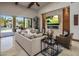 Living room with fireplace and large TV at 10452 E Quartz Rock Rd, Scottsdale, AZ 85255