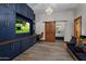 Home office with barn door and wood floors at 10452 E Quartz Rock Rd, Scottsdale, AZ 85255