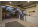 Outdoor kitchen with stainless steel appliances and ceiling fan at 10452 E Quartz Rock Rd, Scottsdale, AZ 85255