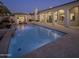 Inviting swimming pool with built-in spa and surrounding patio at 10452 E Quartz Rock Rd, Scottsdale, AZ 85255