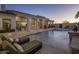 Relaxing poolside view with lounge chairs and access to the home's interior at 10452 E Quartz Rock Rd, Scottsdale, AZ 85255