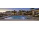 Expansive pool with waterfall, mountain views, and comfortable seating at 10452 E Quartz Rock Rd, Scottsdale, AZ 85255