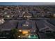 Nighttime aerial view of a single-Gathering home with pool, showcasing surrounding neighborhood at 10538 E Sheffield Dr, Mesa, AZ 85212