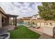 Outdoor kitchen and entertainment area next to the pool at 10538 E Sheffield Dr, Mesa, AZ 85212