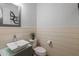 Modern powder room with shiplap walls and a floating vanity at 10538 E Sheffield Dr, Mesa, AZ 85212