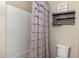 Simple bathroom with shower/tub and a decorative shower curtain at 10538 E Sheffield Dr, Mesa, AZ 85212