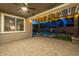 Relaxing covered patio with ceiling fan and lighting at 10538 E Sheffield Dr, Mesa, AZ 85212