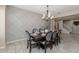 Elegant dining room features a large table, chandelier, and stylish wall decor at 10538 E Sheffield Dr, Mesa, AZ 85212