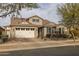 Home's exterior view with a two-car garage at 10538 E Sheffield Dr, Mesa, AZ 85212