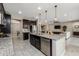 Large kitchen island with seating and granite countertops at 10538 E Sheffield Dr, Mesa, AZ 85212