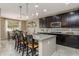 Modern kitchen with granite countertops and dark cabinetry at 10538 E Sheffield Dr, Mesa, AZ 85212