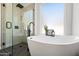 Bathroom with freestanding tub and walk-in shower at 1082 W Aspen Ave, Gilbert, AZ 85233