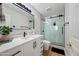 Modern bathroom with white vanity and glass shower at 1082 W Aspen Ave, Gilbert, AZ 85233