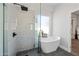 Modern bathroom with a soaking tub and shower at 1082 W Aspen Ave, Gilbert, AZ 85233