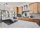 Sleek kitchen with stainless steel sink, faucet, and modern cabinetry at 1082 W Aspen Ave, Gilbert, AZ 85233