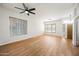 Spacious living room featuring hardwood floors and large windows at 1082 W Aspen Ave, Gilbert, AZ 85233