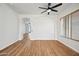 Living room with hardwood floors, and view into another room at 1082 W Aspen Ave, Gilbert, AZ 85233