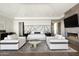 Elegant main bedroom with sitting area and fireplace at 10944 E Whistling Wind Way, Scottsdale, AZ 85255