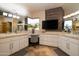 Large bathroom with double sinks and a tv at 12308 N 119Th St, Scottsdale, AZ 85259