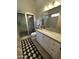 Modern bathroom with white vanity, frameless shower, and patterned rug at 12308 N 119Th St, Scottsdale, AZ 85259