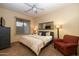 Comfortable bedroom with a king-size bed and seating area at 12308 N 119Th St, Scottsdale, AZ 85259