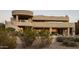 Contemporary home with stucco exterior, multiple levels, and a large covered patio at 12308 N 119Th St, Scottsdale, AZ 85259