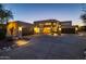 Night view of a contemporary home with attractive landscaping and a spacious driveway at 12308 N 119Th St, Scottsdale, AZ 85259