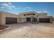 Modern architectural home featuring a three-car garage and expansive driveway at 12308 N 119Th St, Scottsdale, AZ 85259