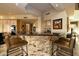 Island kitchen with granite countertops and a breakfast bar at 12308 N 119Th St, Scottsdale, AZ 85259