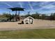 Community playground featuring swings, a slide, and shaded play area for Gathering fun at 12308 N 119Th St, Scottsdale, AZ 85259