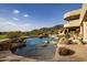 Large freeform pool with rock features at 12308 N 119Th St, Scottsdale, AZ 85259