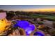 Night view of a resort-style pool with lights at 12308 N 119Th St, Scottsdale, AZ 85259