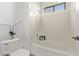 Clean bathroom with a shower/tub combo and window at 12418 W Pima St, Avondale, AZ 85323