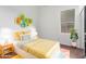 Cozy bedroom with yellow bedding and colorful decor at 12418 W Pima St, Avondale, AZ 85323