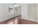 Bedroom with mirrored closet and wood floor at 12418 W Pima St, Avondale, AZ 85323