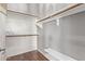 Walk-in closet with wood shelving and hanging rods at 12418 W Pima St, Avondale, AZ 85323