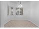 Bright dining area with tile floors and plantation shutters at 12418 W Pima St, Avondale, AZ 85323